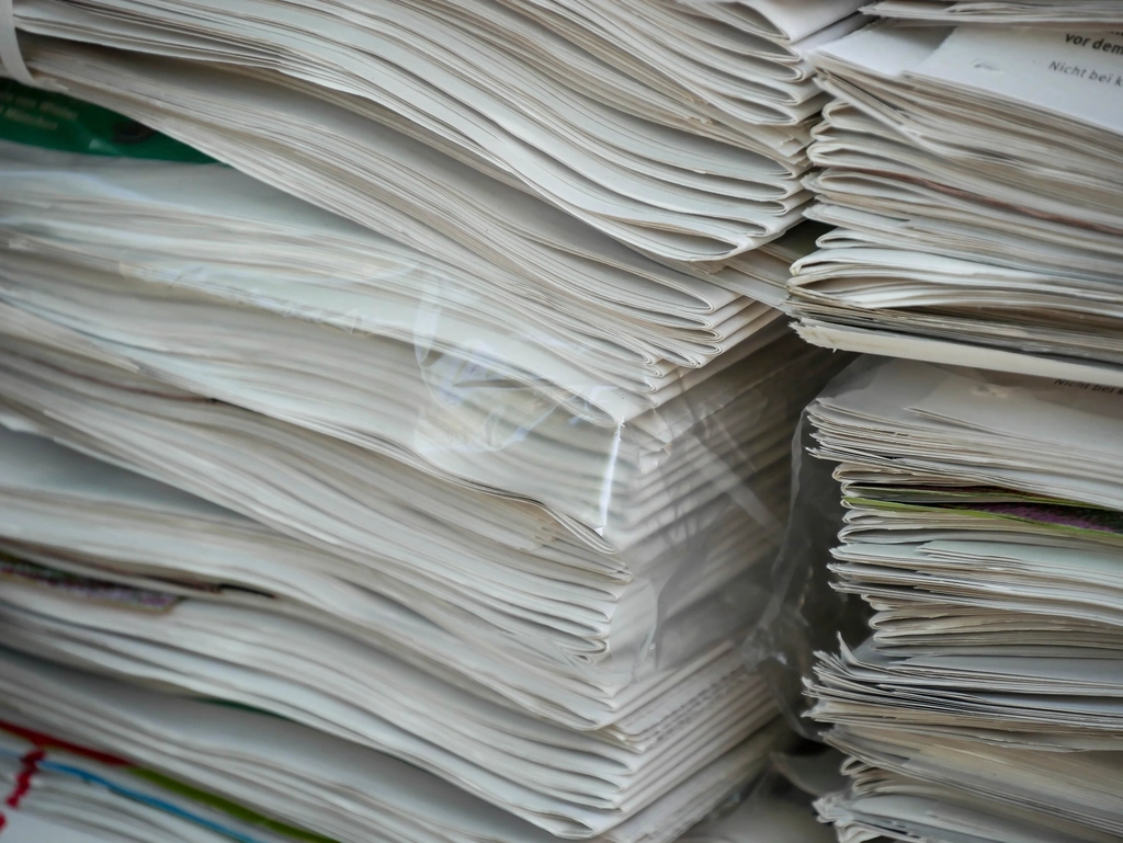 A tall stack of printed papers seen edge-on.